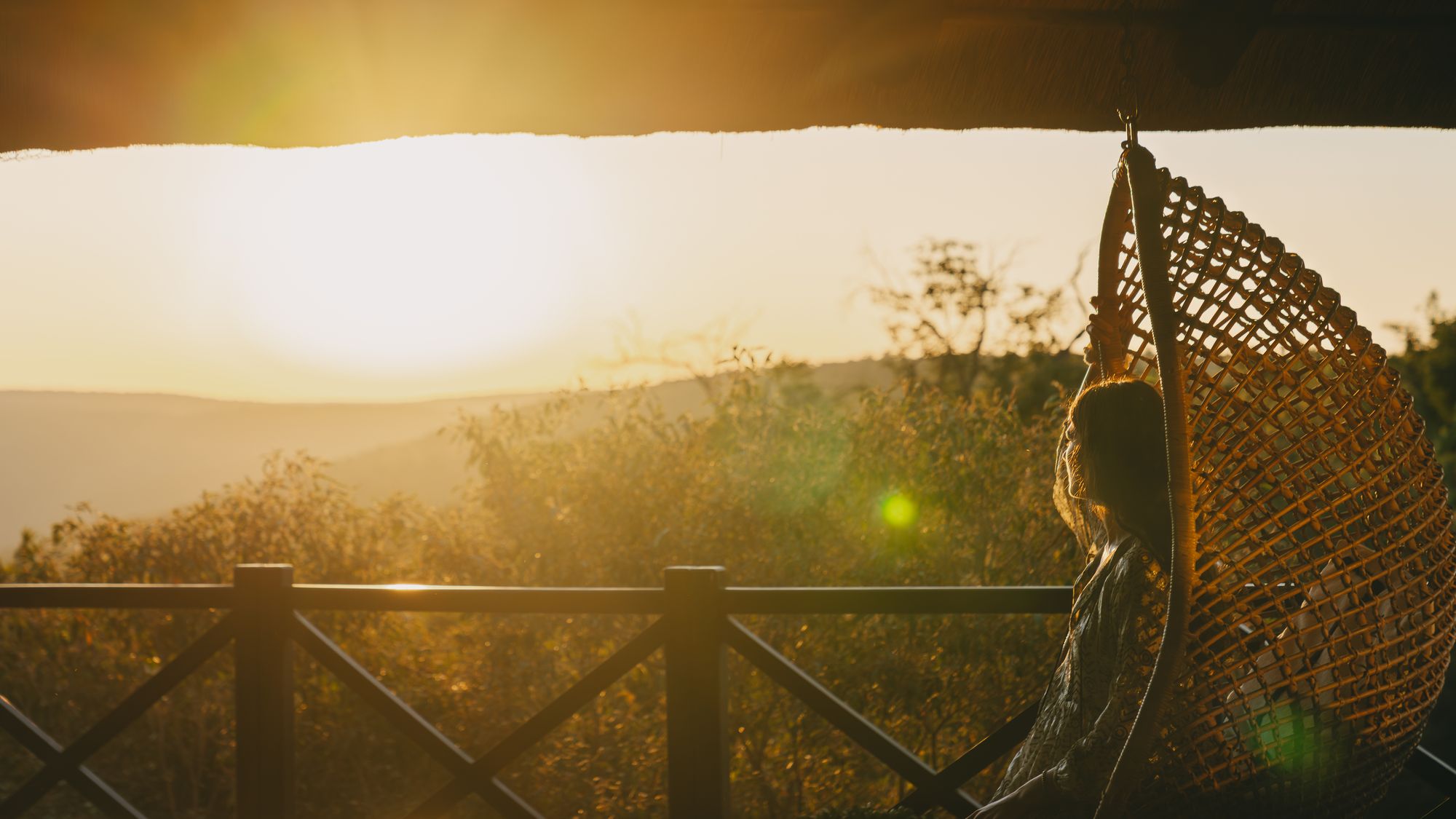 Golden sundowner light over the valley at Laluka Safari Lodge